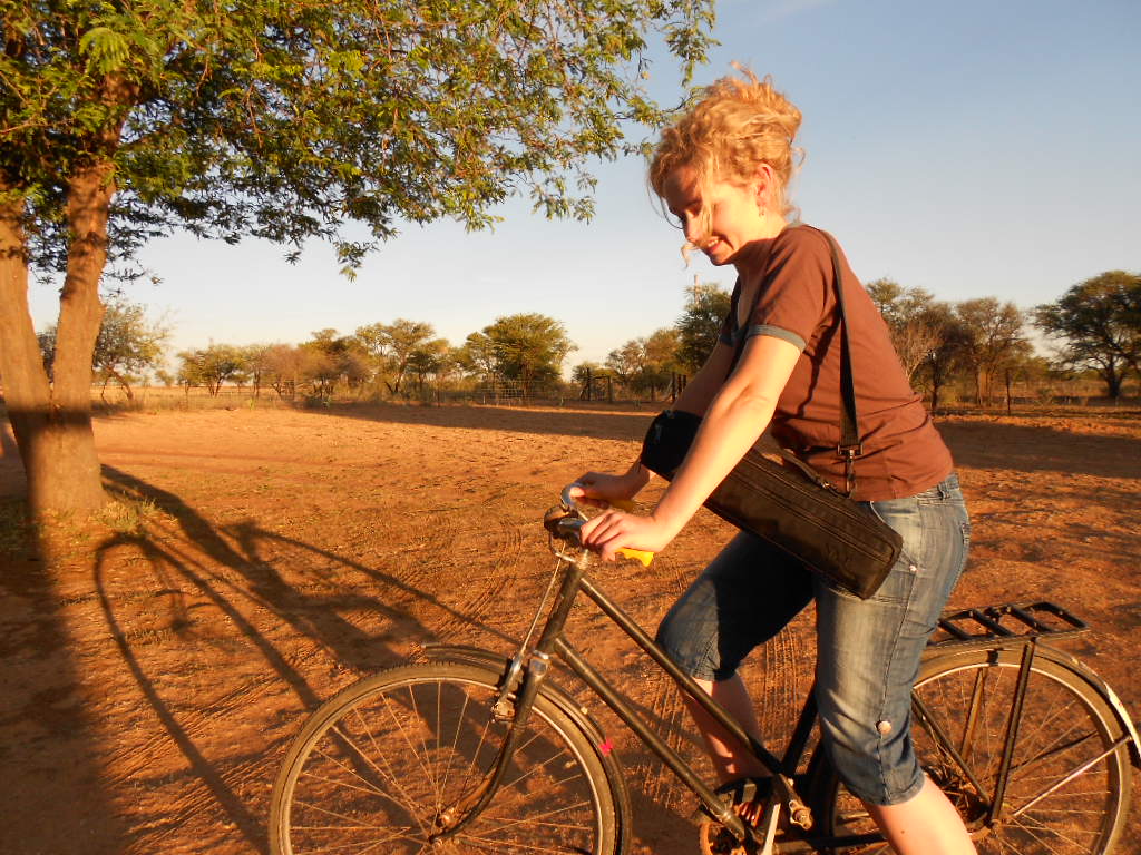 Marlene Verwey riding a bicycle on a Kalahari farm