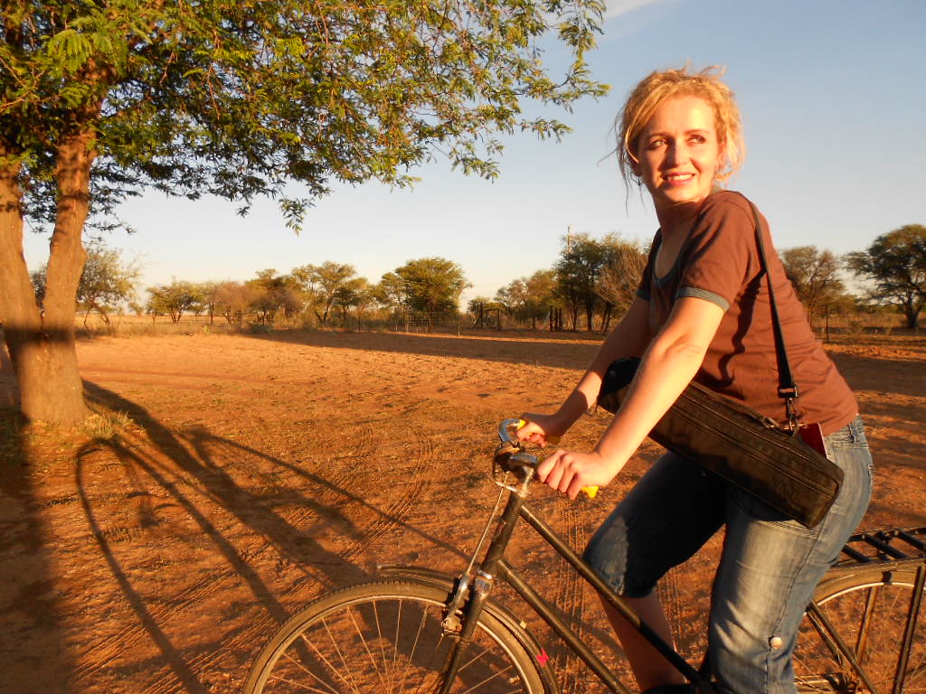 Marlene Verwey riding a bicycle on a Kalahari farm